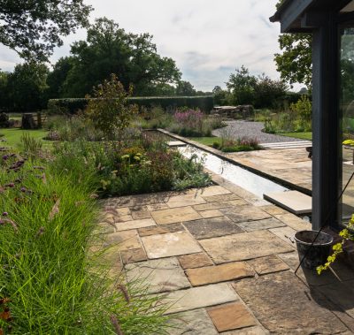 Naturalistic modern garden design featuring shallow water rill, Wilmslow